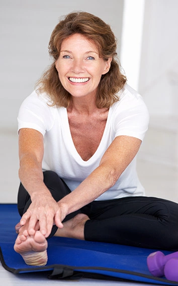 Active woman stretching comfortably — Joint Genesis joint mobility support